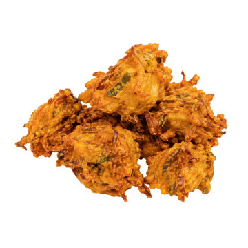 Pile of crispy golden brown onion bhaji, a popular Indian snack, isolated on a clean white background