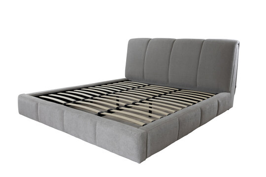 Modern grey upholstered bed frame with wooden slats isolated on transparent background for interior design