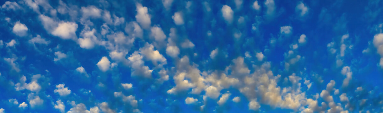 White puffy clouds against blue sky