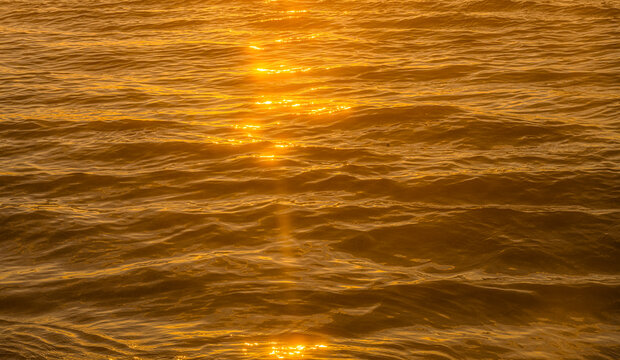 Close-up of ocean surface reflecting sunlight