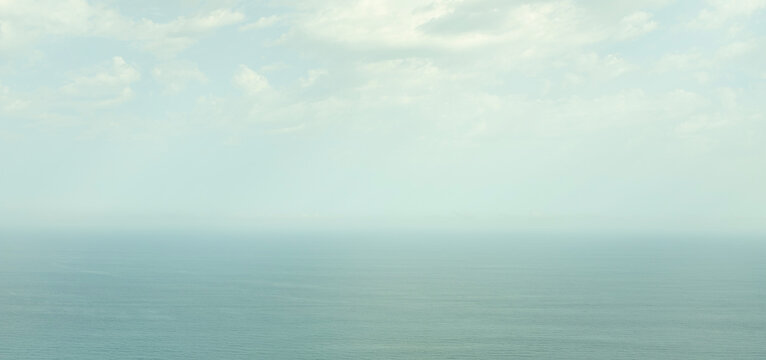 Sky above calm sea in fog