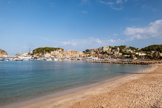 Sandy beach and old town buildings
