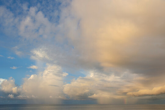 Clouds over calm gulf at sunset