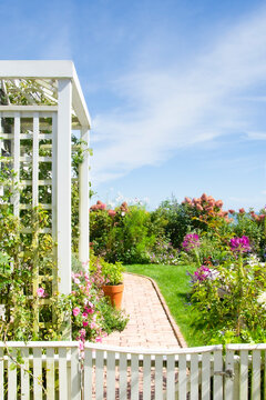 Arbor and flower garden on sunny day
