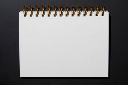 Blank notebook on black background