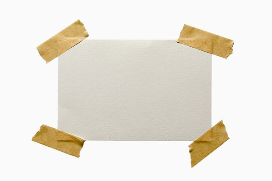 Blank textured paper taped on white background