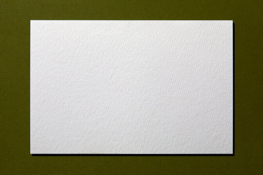 Blank textured paper on green Background