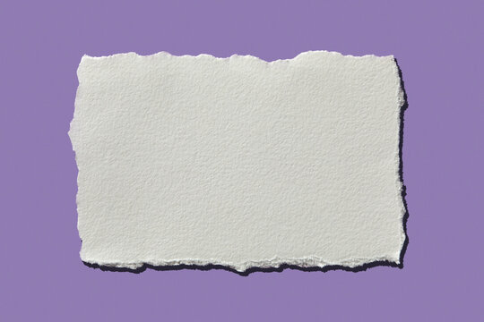 White torn paper on purple background