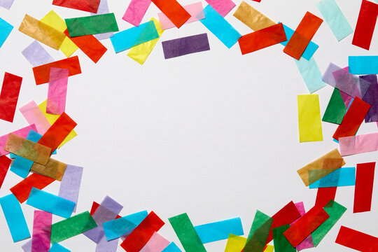 Colorful confetti on white background
