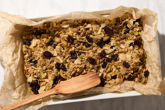 Overhead view of homemade granola on baking sheet
