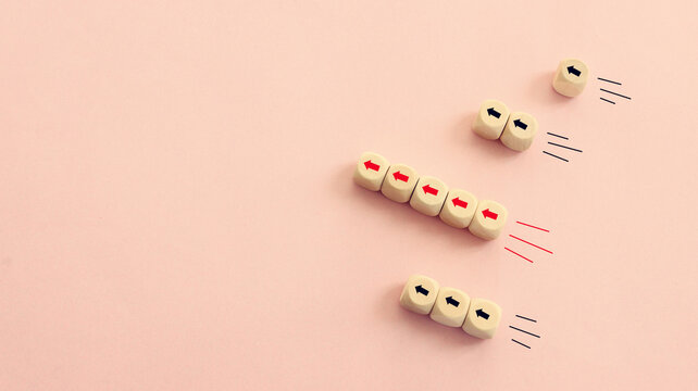 Arrows on wooden blocks, idea of thinking differently, setting goals and thinking about solution