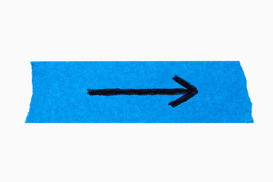 Black arrow on torn blue painters tape on white background
