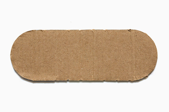 Rounded piece of cardboard on white background