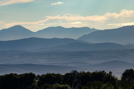 Hill and mountain layers at sunset