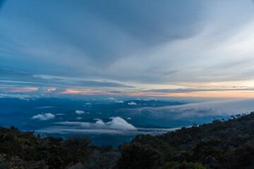 Dramatic sky above dense forested mountain range © jinhongljh