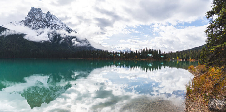 Emerald lake near mountain under cloudy sky in Banff national park at Alberta, Canada