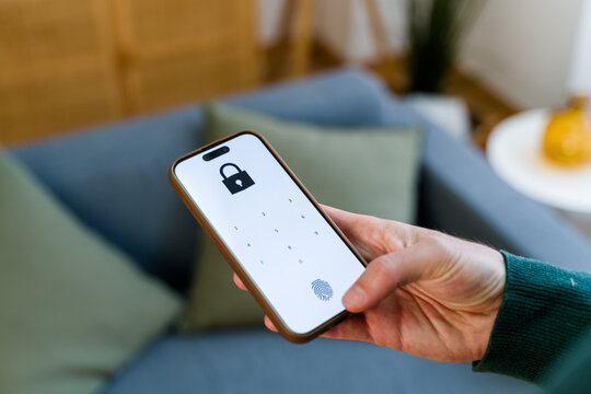 Smartphone displaying lock screen with numeric keypad and fingerprint