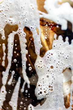 Close-up of foam bubbles forming an abstract wet texture pattern