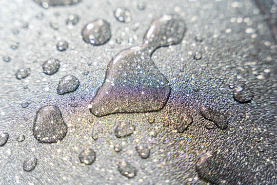 Water droplets creating a sparkling textured surface background