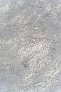 Abstract gray textured surface with scratched paint marks
