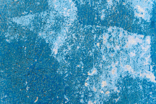 Blue abstract textured surface with peeling and weathered paint