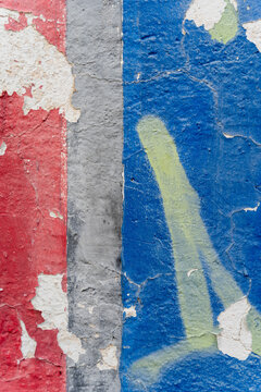 Peeling layered paint texture on weathered wall surface