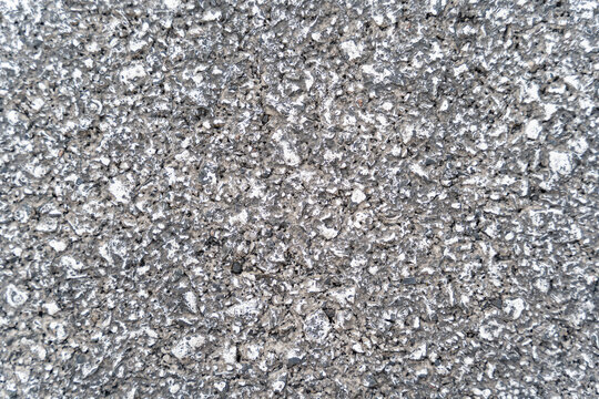 Detailed rough gray concrete surface texture close-up