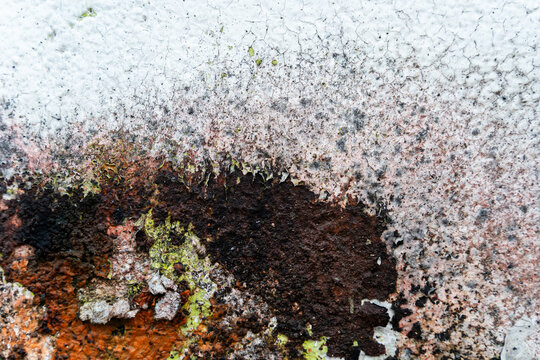 Peeling and rusted paint texture on weathered surface