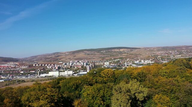  Aerial view of autumn hills and urban cityscape, Cluj Napoca, Romania