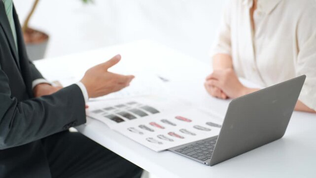 A man and a woman having a meeting. Customer service, consultation, business, sales, customer, meeting, sales, smile, explanation, proposal, B2C, sales, customer service.