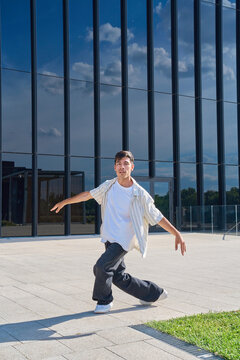 Young male dancer performing urban contemporary dance