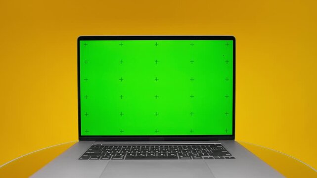 Front View Laptop Green Display Template on Yellow