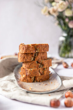 Sliced Hazelnut banana bread stacked on a plate