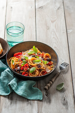 Pasta with sundried tomato sauce, black kalamata olives, garlic, basil