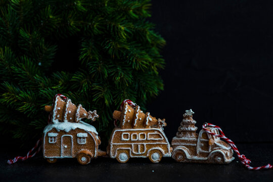 Gingerbread cookies shaped like cars and trucks decorated with sugar
