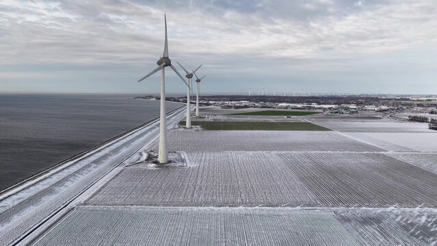 Aerial view of wind turbines at Westermeerdijk in the Netherlands during winter