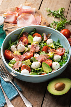 Rocket salad with cherry tomatoes, mini mozzarella, avocado