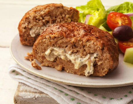 Lamb meatball stuffed with feta cheese and served with fresh salad
