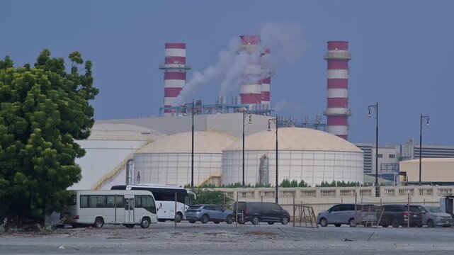 Steam rises above an industrial power generation facility in the UAE