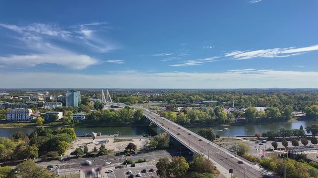 Cityscape of Magdeburg, Germany, Saxony-Anhalt, from above, time-lapse with motion blur view to new Strombr&uuml;cke in downtown district on a sunny autumn day