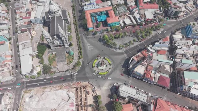 Top down aerial view of Thu Dau Mot Roundabout and traffic near Phu Cuong Cathedral, Vietnam