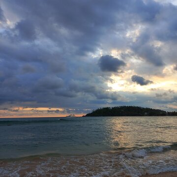 Golden Light Breaking Through Storm Clouds Over a Tropical Headland, Parrot Rock Beach, Matara