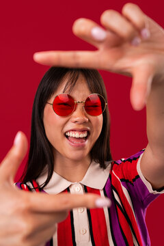 Beautiful asian woman portrait, asian woman framing face with hands smiling