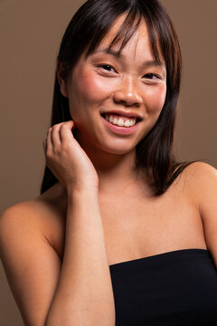 Beautiful asian woman portrait, young asian woman smiling looking at camera
