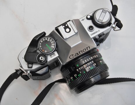 Canon AE-1 Program film camera on white background
