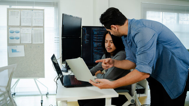 software engineers team developing autonomous AI agents and agentic terminal coding in a cowork environment.Concept of constitutional AI,agentic coding,large language models and reinventing software. 