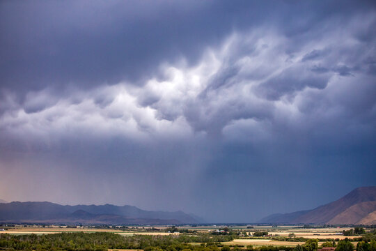 Dark storm clouds over fields