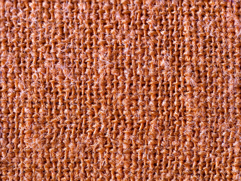 Textured detail of terracotta cotton fabric