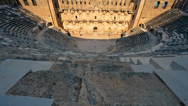 Aspendos Ancient City in Antalya, Turkiye, showcases timeless Roman heritage beneath a vibrant blue sky.
