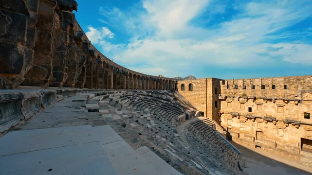 Aspendos Ancient City in Antalya, historic Roman architectural ruins stand majestically against a vibrant clear blue sky.